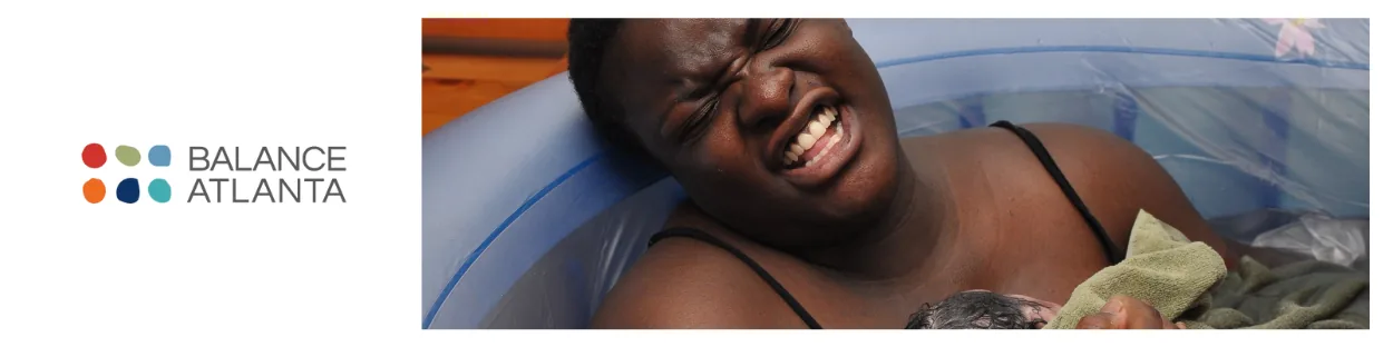 Person in a birthing pool holding a newborn against their chest, with the Balance Atlanta logo visible to the left.