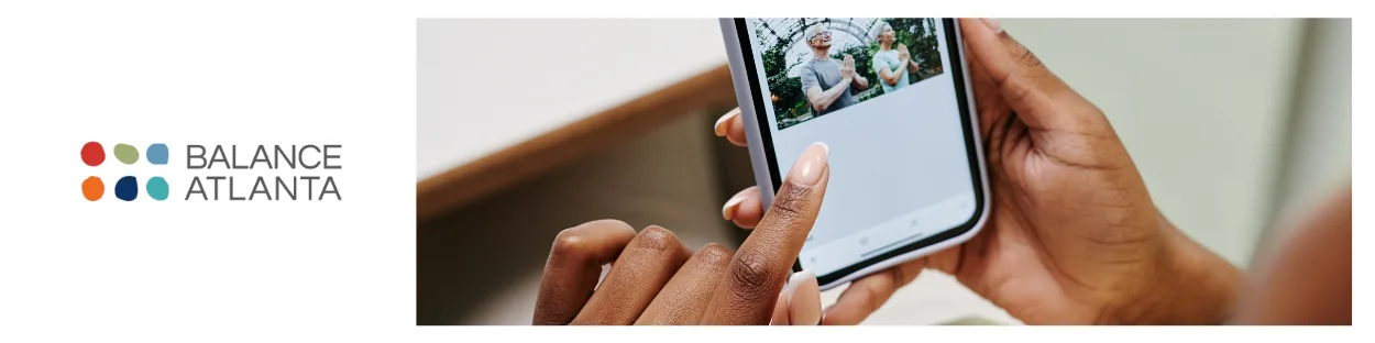 Hands holding a smartphone and tapping a photo on the screen, with the Balance Atlanta logo to the left.