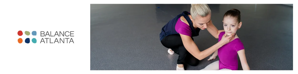 Adult kneeling and gently supporting a seated girl's neck while the girl wears a pink ballet leotard; Balance Atlanta logo at left.