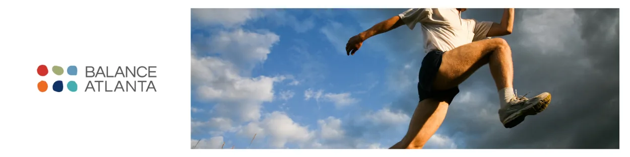 Person mid-leap in running shorts and sneakers against a blue sky with clouds, with the Balance Atlanta logo on the left.