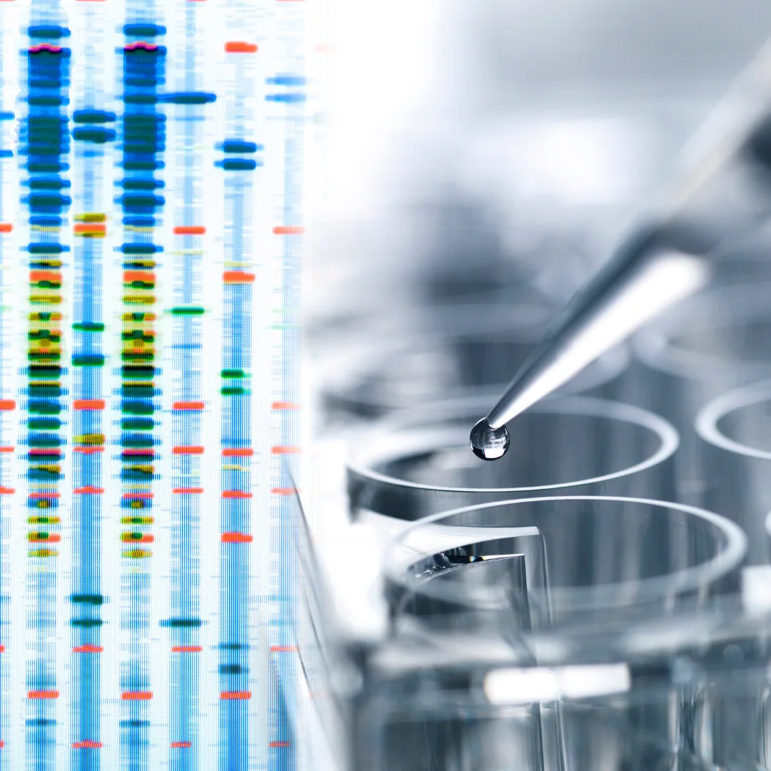 Colorful vertical DNA sequencing bands at left beside a pipette dispensing a droplet over clear laboratory test tubes.