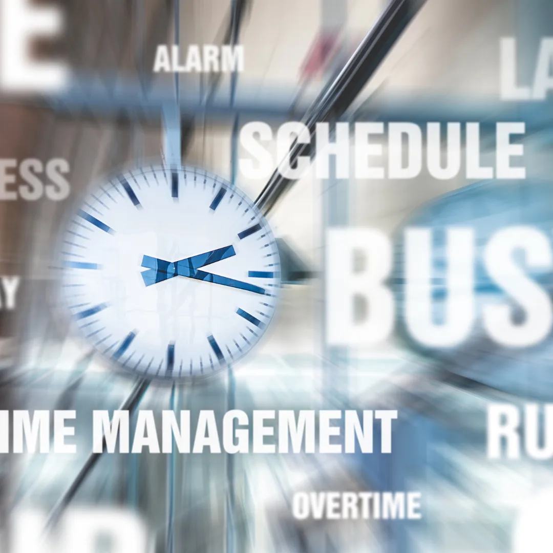 Blurred analog clock with overlaid words like "schedule", "busy", and "time management" conveying time pressure that can relate to chronic fatigue